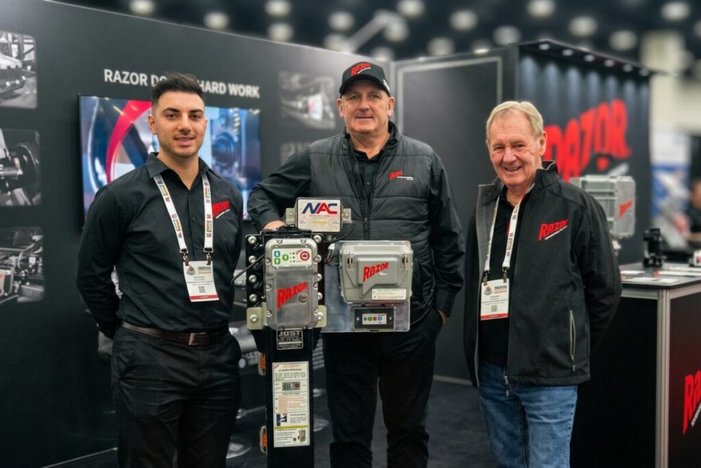 Razor International team exhibiting its electric drive systems at a trade show.